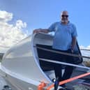 Greg and Elliot Collins aboard the boat they will row across the Atlantic in