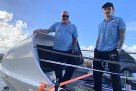 Greg and Elliot Collins aboard the boat they will row across the Atlantic in