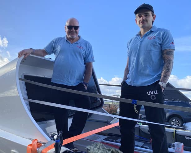 Greg and Elliot Collins aboard the boat they will row across the Atlantic in