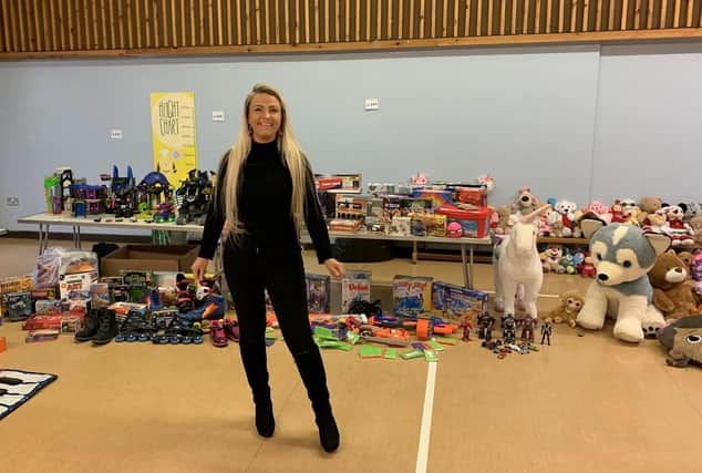 Organiser Lisa Godber with some of the toys, games and books donated last year in Melton
