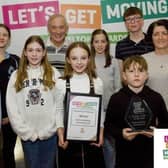 Young members of Melton Mowbray Swimming Club receive an award at last year's Let’s Get Moving Melton Awards from borough council leader, Councillor Pip Allnatt