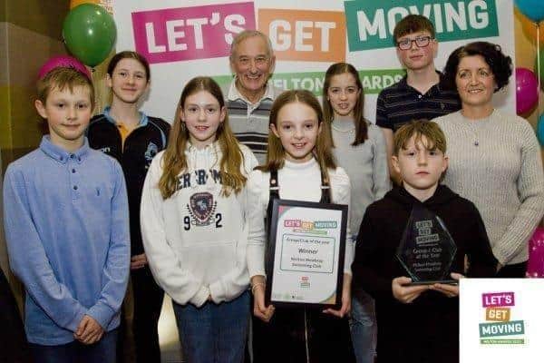 Young members of Melton Mowbray Swimming Club receive an award at last year's Let’s Get Moving Melton Awards from borough council leader, Councillor Pip Allnatt