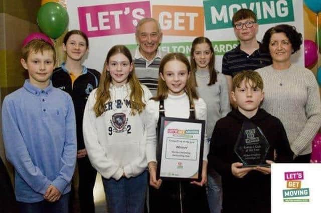 Young members of Melton Mowbray Swimming Club receive an award at last year's Let’s Get Moving Melton Awards from borough council leader, Councillor Pip Allnatt