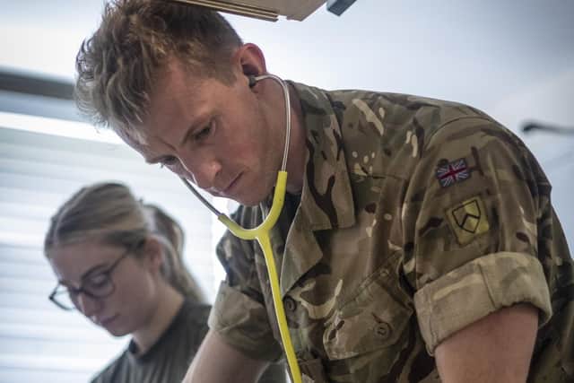 An army vet operates on a military working dog at the DATR