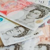 File photo of a pile of pound sterling notes