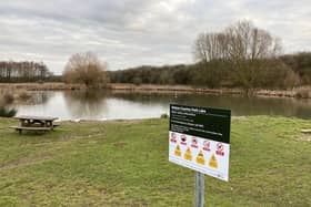 Melton Country Park's lake with one of the new safety signs