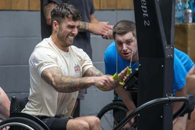 Cai Vickers tries the Ski-Erg test at the Hambo Throwdown watched by organiser George ThompsonPHOTO Alistair Langham/S17 Photography