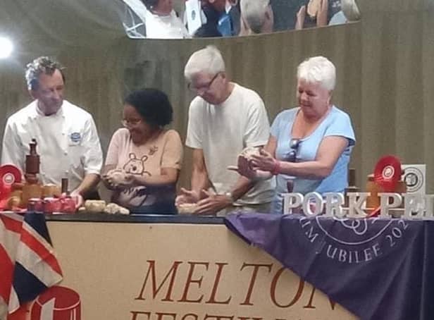 Stephen Hallam (left) demonstrates the art of hand-raising a Melton Mowbray pork pie at this year's PieFest event at the weekend