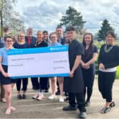 Some of the staff at Ragdale Hall Spa with a cheque at the launch of the Ragdale Hall Community Chest 2024