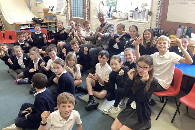 The MADMAC team pictured during a visit to a local school
