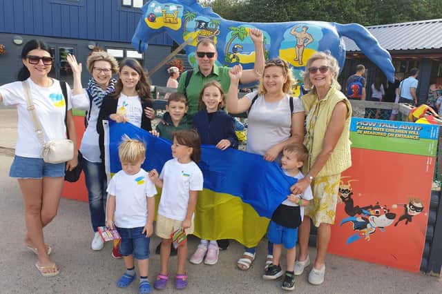 Some of the Ukrainians who have settled in the Melton area pictured enjoying their day out at Twin Lakes