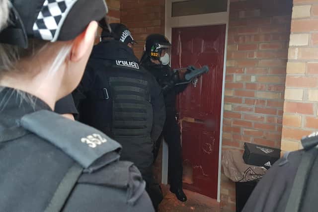 Officers prepare to raid a property in Rutland Street, Melton, where drug-related activity was suspected