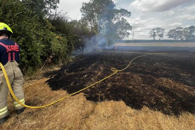 Melton firefighters tackling a field fire during last month's latest heatwave