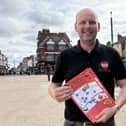 Melton BID manager James Colclough with entry sheets for the Halloween Trail Quiz