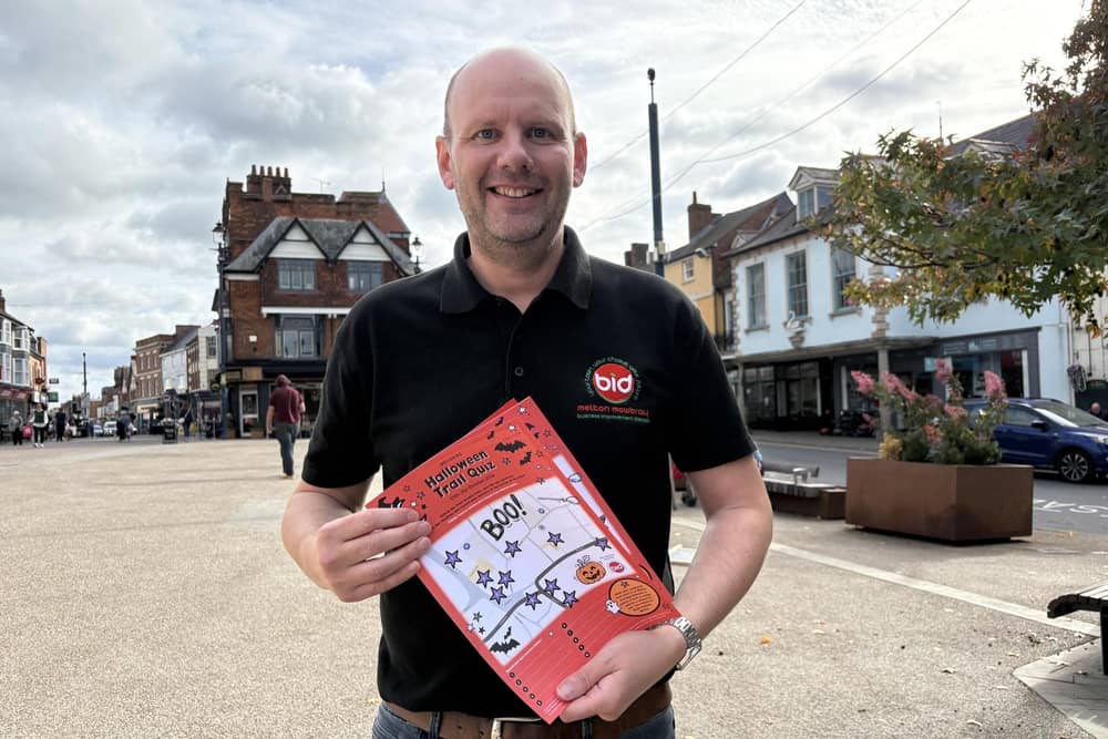 Melton BID manager James Colclough with entry sheets for the Halloween Trail Quiz