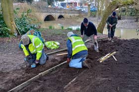 MOWS volunteers lay the path to the River Eye at the new rowing boat hire base in Wilton Park, Melton