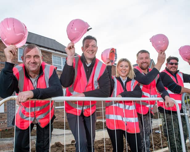 The site team at Barratt Homes' King’s Meadow, off Kirby Lane, Melton, dressed in bright pink hats and vests for the Breast Cancer Now 'Wear it pink' campaign