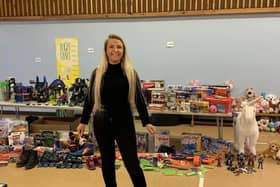 Lisa Godber pictured with some of the Christmas gifts donated for Melton children in a previous year