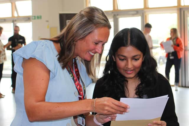 Fiona Ashraf checks her impressive GCSE results with teacher Lucy Neath at John Ferneley College