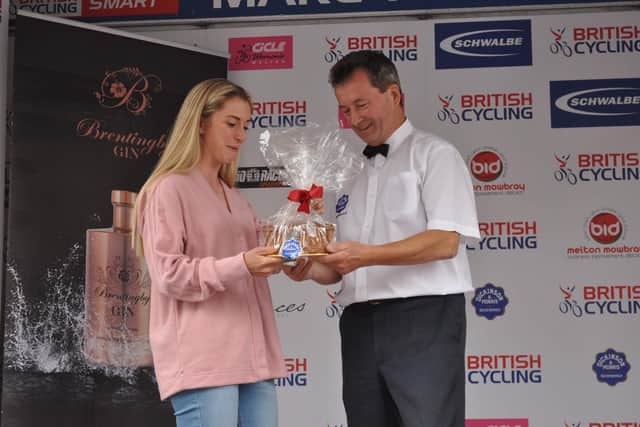 Olympic cycling legend Dame Laura Kenny is presented with a special pie by Stephen Hallam at the presentation ceremony for Sunday's CiCLE events