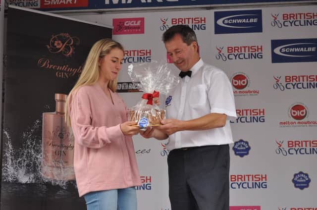 Olympic cycling legend Dame Laura Kenny is presented with a special pie by Stephen Hallam at the presentation ceremony for Sunday's CiCLE events