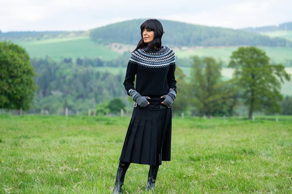 The Traitors III Claudia Winkleman rocks kilt @lekilt, knit @brorafashion and boots @newbottega - picture: BBC ,Studio Lambert, Euan Cherry