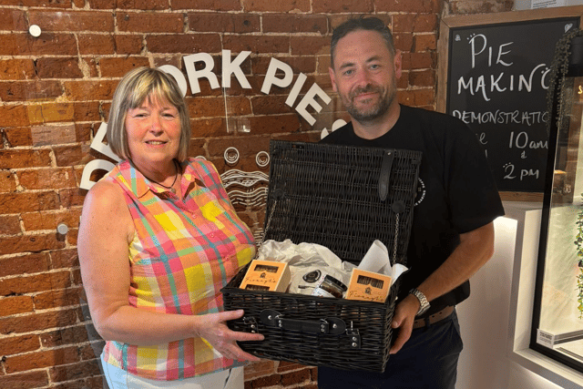 Sandra Ford is presented with her luxury hamper after winning a Melton Times competition to celebrate the 175th birthday of Ye Olde Pork Pie Shoppe