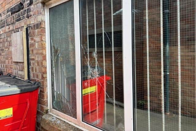 Smashed windows at the rear of the former Melton Times offices, which have been vacant for around eight years
