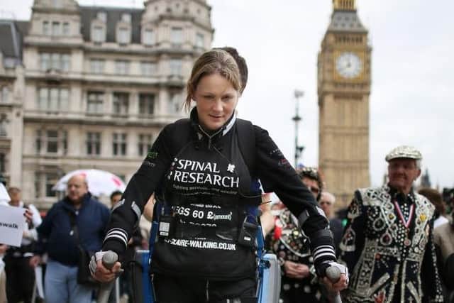 Claire Lomas walks the last mile of the London Marathon on May 8, 2012 wearing a bionic suit (Photo by Peter Macdiarmid/Getty Images)