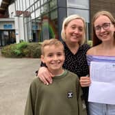 Chloe Young shows off her excellent GCSE results at Long Field Spencer Academy, with mum Ruth and brother Harry
