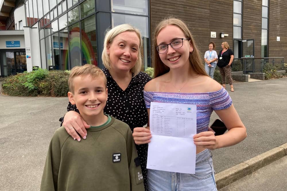 Chloe Young shows off her excellent GCSE results at Long Field Spencer Academy, with mum Ruth and brother Harry