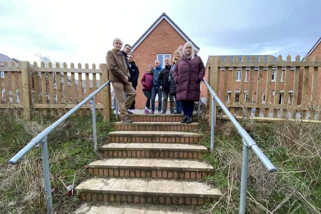 Residents at the top of the 'dangerous' steps leading from Roman Gate to Gilpin Close in Melton