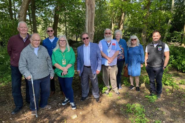 Representatives of Melton Learning Hub, Melton Bowls Club and Melton Mencap at the site of the planned new forest school