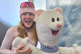 Amelia Coltman with the 2026 Winter Olympics mascot