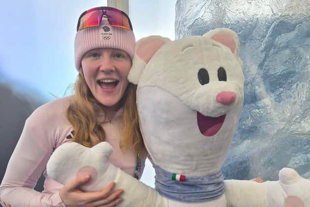 Amelia Coltman with the 2026 Winter Olympics mascot