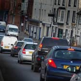 Traffic in Burton Street, in Melton - £3M is to be spent fixing road surfaces across Leicestershire