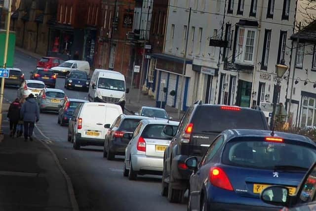 Traffic in Burton Street, in Melton - £3M is to be spent fixing road surfaces across Leicestershire