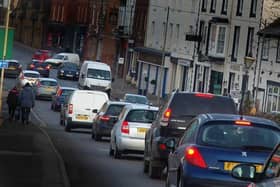 Traffic in Burton Street, in Melton - £3M is to be spent fixing road surfaces across Leicestershire