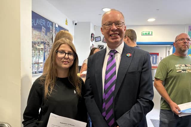 Holly Payne is congratulated by Long Field principal Chris Haggett