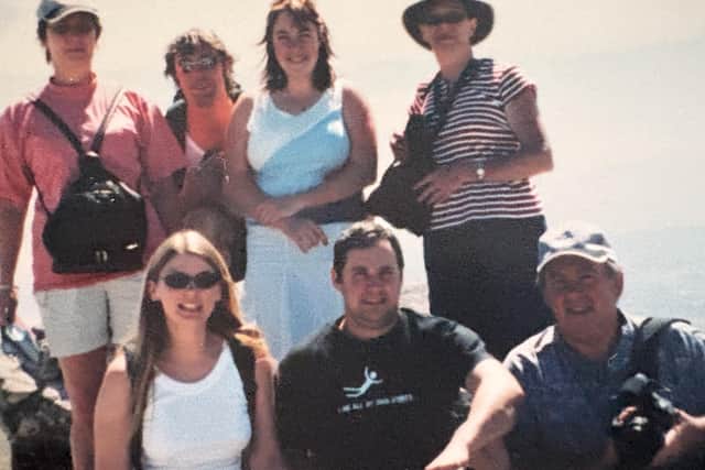A family photo taken at Table Mountain South Africa, in 2004; from left to right starting at the top, Nicky Butler, Simon Jopling (son in law), Maddy Jopling (Butler), Kathleen Farrell (sister in law), Kelly Butler (Daughter in law), Sean Butler and Peter Butler
