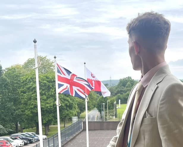Councillor Joseph Boam, deputy leader of the new Reform UK administration, pictured with flags flying at County Hall