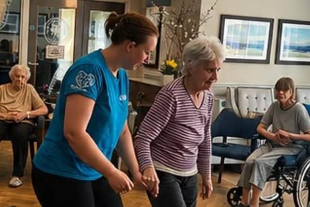 Diane Williams shows off the tap dancing skills she learned as a child during a music session at Wilton Manor Care Home