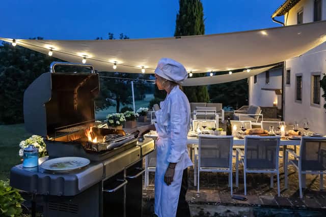 A chef cooks outside at Bosco Ai Frati (photo: Francesca Anichini)