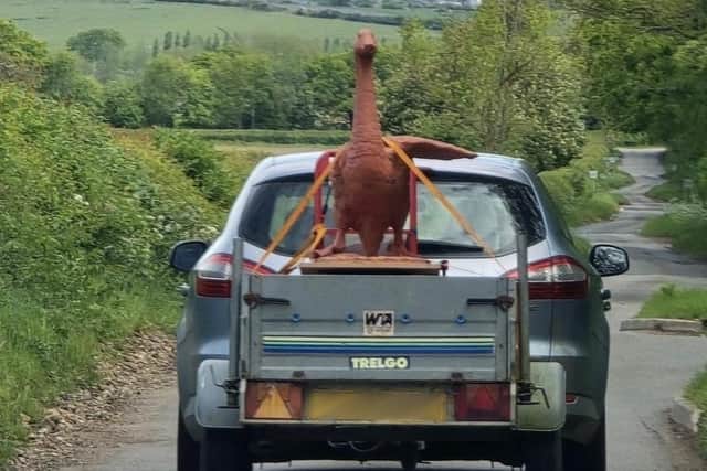 The goose statue being transported on Jo's truck