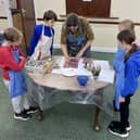 Donna Drouin teaching children at an art class