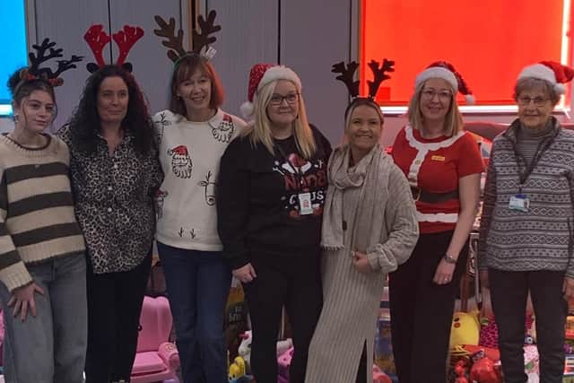 Lisa Godber (third from right) with her volunteers who helped with this year's Melton Christmas toy appeal