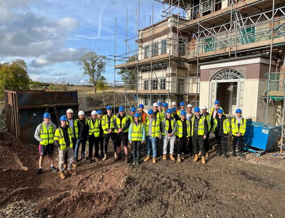 Nottingham Trent University students meet with Steve Bateman, of Grace Homes, at the Sysonby Lodge conversion project