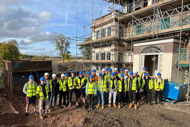 Nottingham Trent University students meet with Steve Bateman, of Grace Homes, at the Sysonby Lodge conversion project