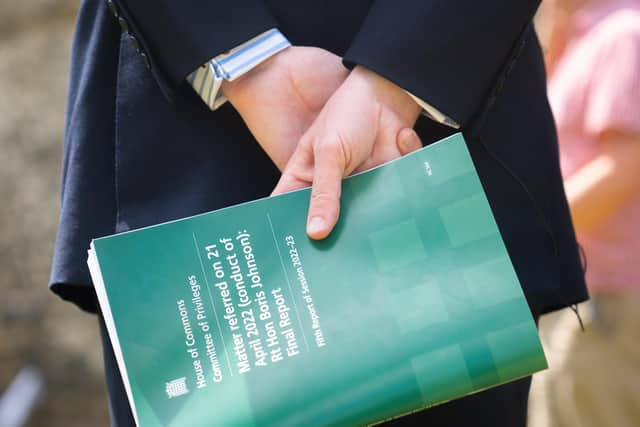 Jacob Rees-Mogg, holds a copy of the House of Commons Committee of Privileges report into whether former prime minister Boris Johnson misled Parliament over partygate. PIC: James Manning/PA Wire