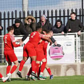 Melton celebrate Kairo Edwards-John's equaliser against Loughborough. Photo: Mark Woolterton.